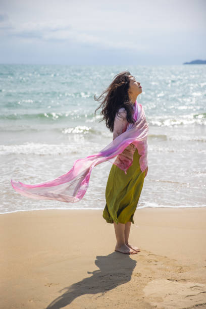 istock Woman raped around scarf on the beach 1387224348
