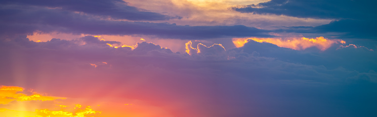 Dramatic sunset sky in beautiful colors. Panoramic view.