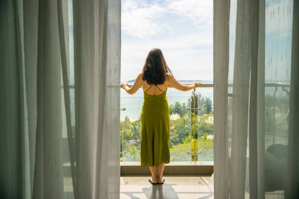 istock The young woman stood on the balcony 1387224859