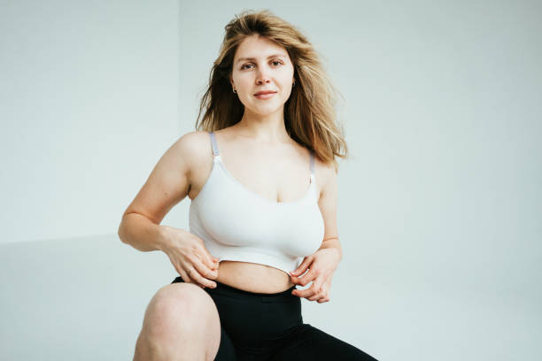Handsome blond hair plus size model Handsome blond hair plus size model woman wearing underwear in white photo studio plus size woman fashion laughing stock pictures, royalty-free photos & images