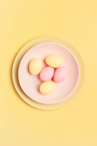 istock Easter colored pastel eggs on the plate, holiday card 1387224982