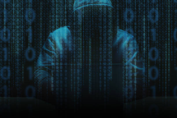 istock Unrecognizable person using a laptop computer with a hoodie 1387226363
