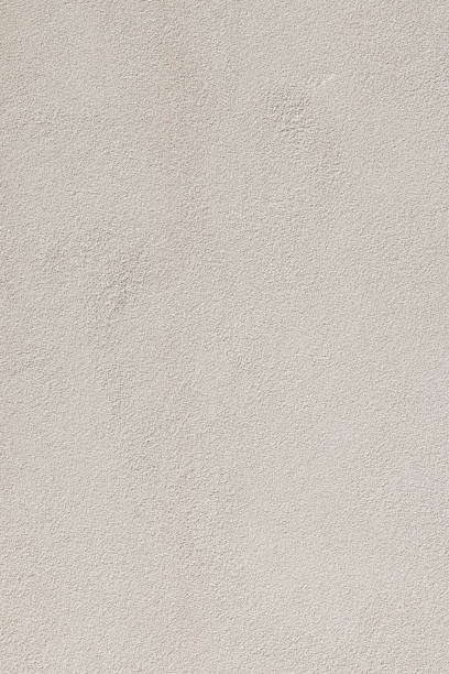 istock Part of a cream colored concrete wall 1387227314