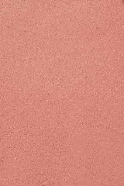 istock Part of a peach colored concrete wall 1387227361