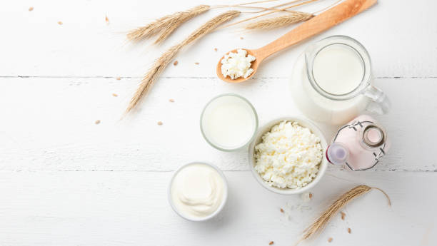 istock Organic dairy products on a white wooden background 1387230256
