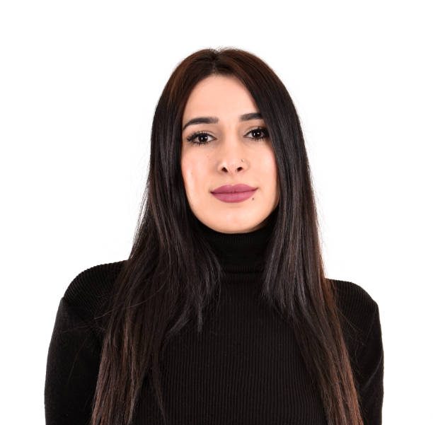 istock young woman in black sweater looking at camera 1387231975