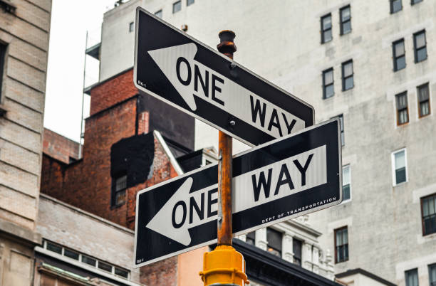 istock Two One Way sign pointing in different directions, New York City 1387241202