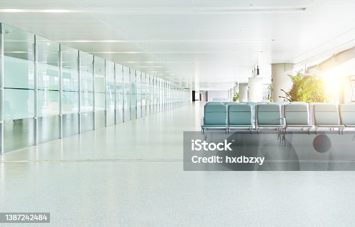 istock Empty departure lounge in airport 1387242484