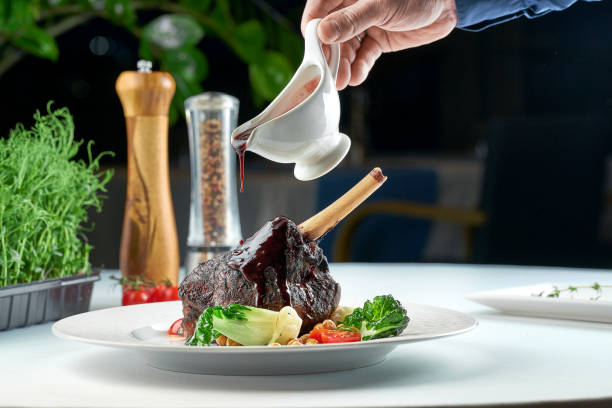 istock Baked lamb shank is poured with sauce composed with spices. 1387242501