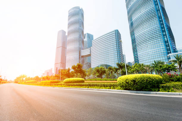 istock Urban road and modern office buildings 1387242603