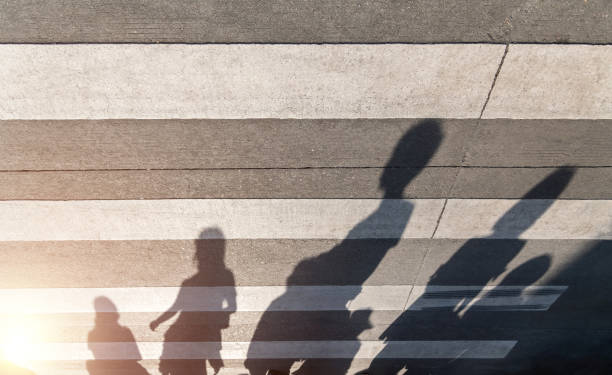 istock Shadows of people on the crosswalk 1387242670