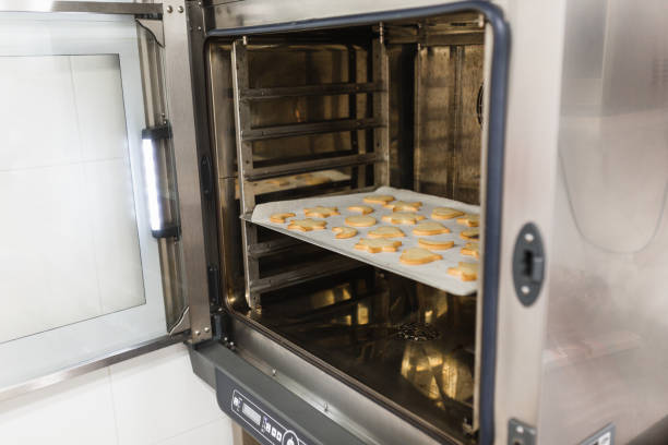 istock Freshly baked cookies inside the bakery oven 1387243722