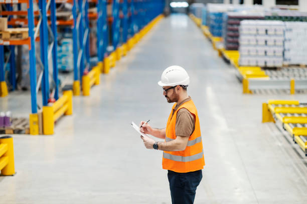 istock A manager finishing check list in storage. 1387247567