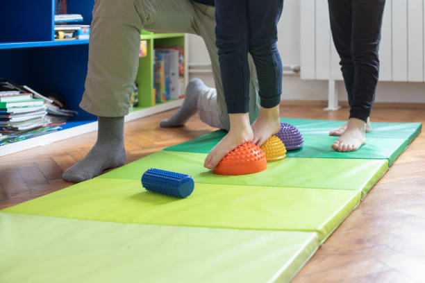 istock Fixing flat feet at home with dad 1387248157