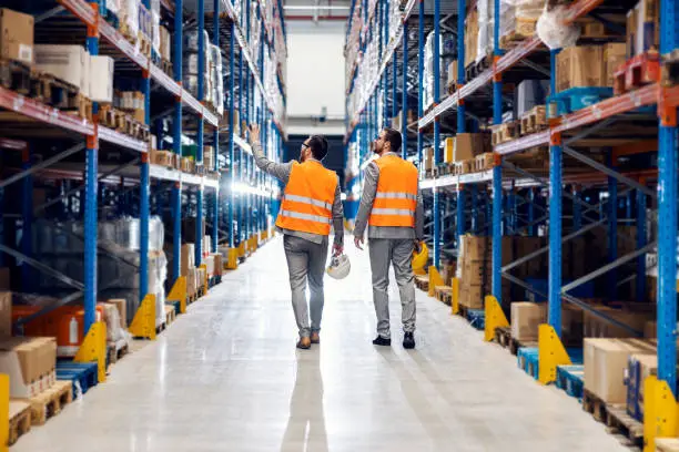 Photo of Businessman showing storage to his business partner.