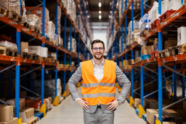 istock Proud warehouse owner smiling at the camera. 1387249013