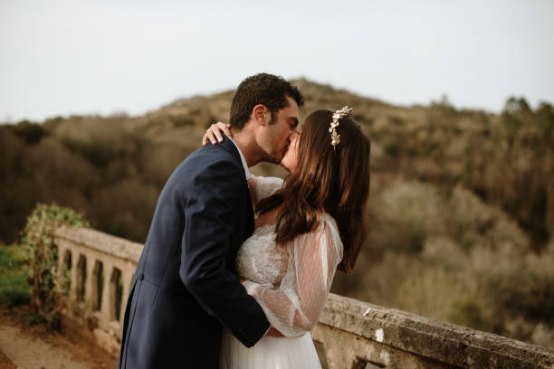istock Just married couple kissing 1387251232
