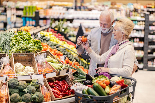 istock A senior couple purchasing vegetables at supermarket. 1387251441