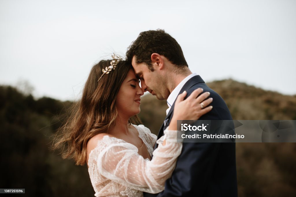 Portrait of a just married couple Portrait of a just married couple with wedding clothes Wedding Stock Photo