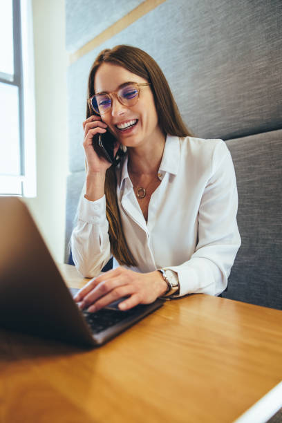 istock Happy entrepreneur smiling during a phone call 1387251812