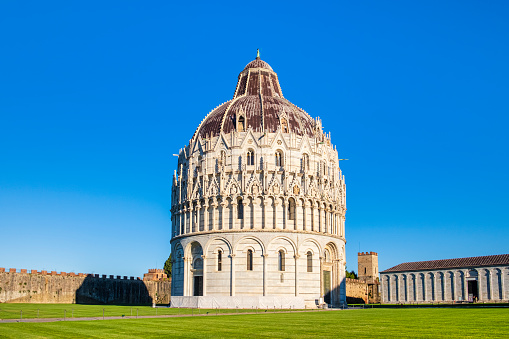Baptistery of Pisa, one of the monumental buildings in the famous Piazza dei Miracoli, formally known as Piazza del Duomo, listed as a UNESCO World Heritage Site since 1987