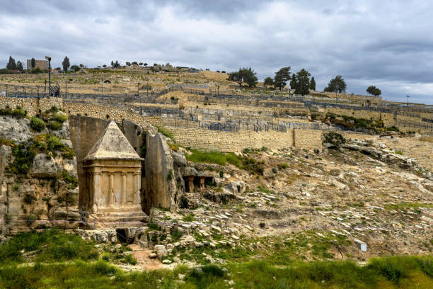 Tomb of Zechariah in Jerusalem East Jerusalem, Palestine, May 2, 2019: View of the Tomb of Zechariah - an ancient stone monument which is considered in Jewish tradition to be the tomb of Zechariah ben Jehoiada. kidron valley stock pictures, royalty-free photos & images