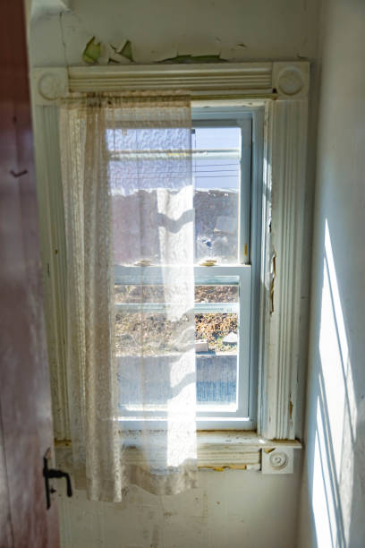 istock Looking out from an old window, architecture outdoor view, perspective composition, morning light, old fashion. 1387260331