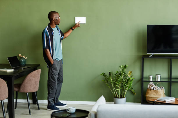 istock African American Man Operating Smart Home System 1387261885