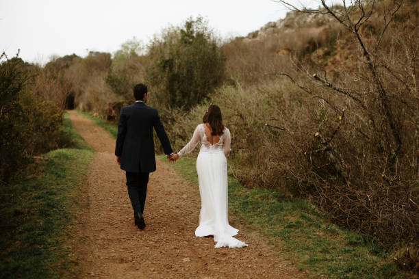 istock Rear view of a just married couple 1387262084