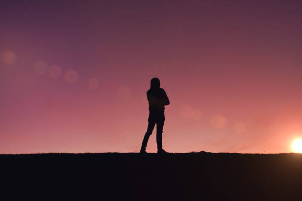 istock man trekking in the mountain with a beautiful sunset 1387262742