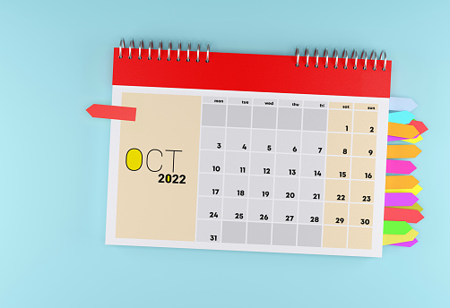 October 2022 Calendar With Sticky Note Paper On The Bleu Background. Time And Calendar Concept