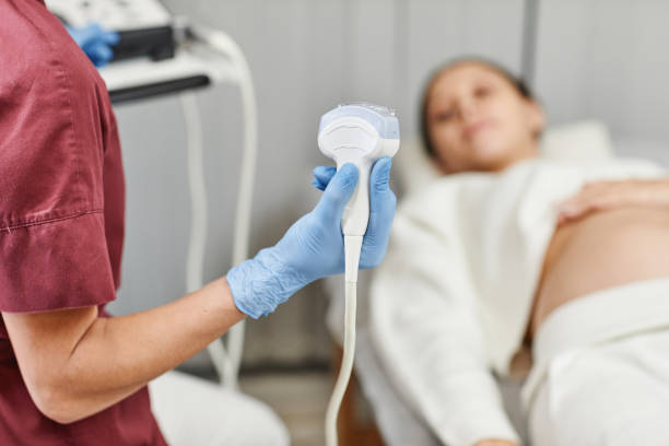istock Nurse Holding Ultrasound Transducer 1387263867