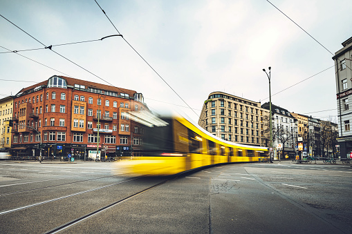 yellow street car crossing Rosenthaler Platz in Berlin