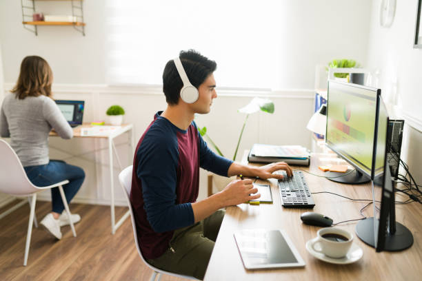 istock Freelance couple working together 1387270908