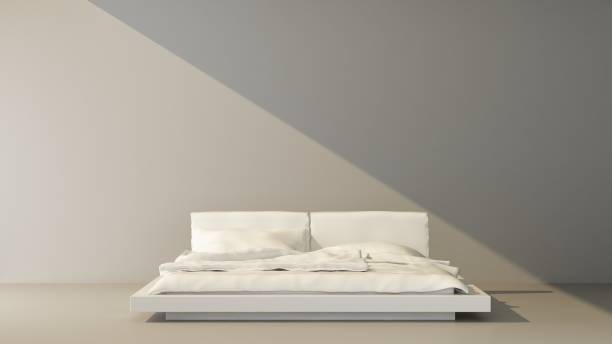 istock beam of light falls on a stylish bed on gray background 1387271176