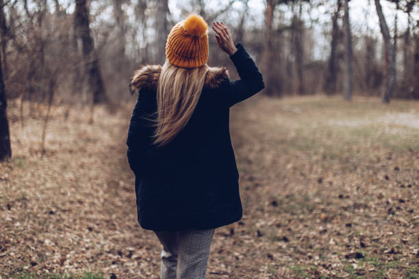 istock Cheerful beautiful blonde in the nature 1387272502