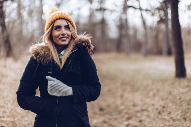 istock Cheerful beautiful blonde in the nature 1387272518
