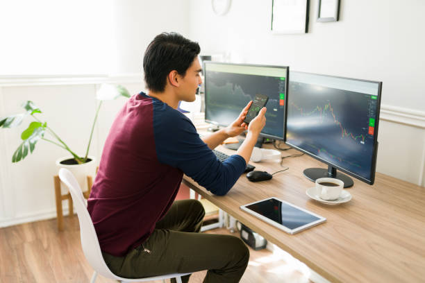 istock Cheerful broker checking the stock market 1387272744