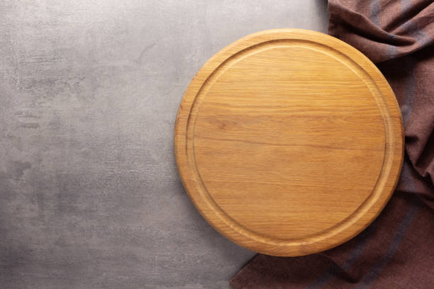 istock Cutting board and napkin tablecloth on stone background 1387273860