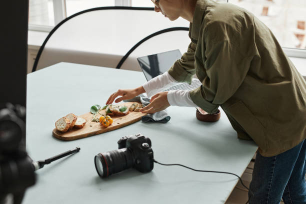Food Photographer Arranging Scene