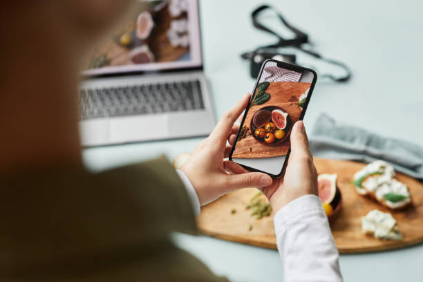 Professional Mobile Photography Close up of young woman taking aesthetic photo of food using smartphone for social media, copy space taken on mobile device stock pictures, royalty-free photos & images