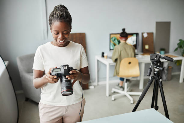 istock African American Female Photographer in Studio 1387274526