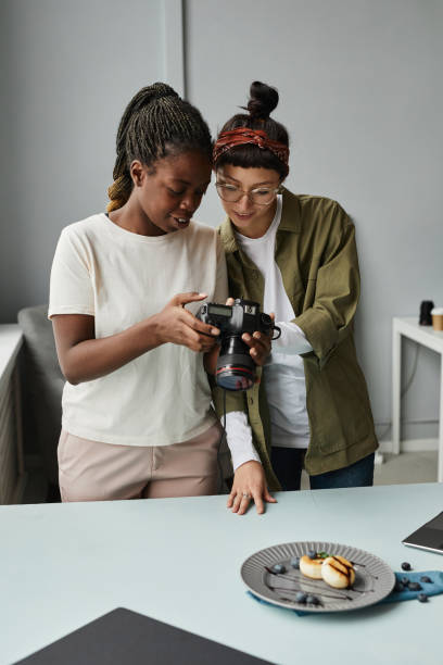 istock Two Female Photographers in Studio 1387274529