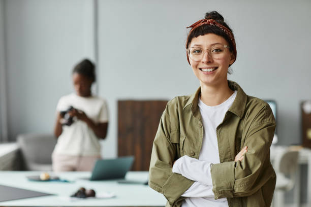 istock Smiling Female Photographer Portrait 1387274533