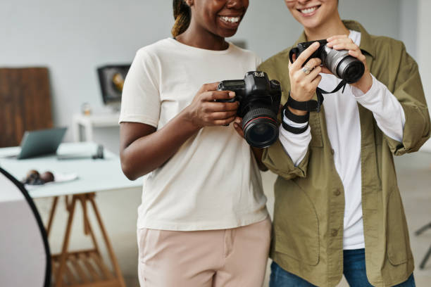 istock Two Photographers Close Up 1387274544