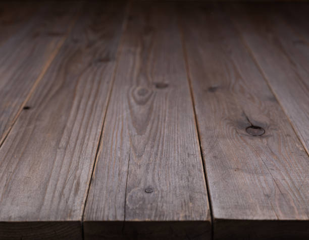 istock Wooden table top background texture.  Wood tabletop front view with copy space 1387275866