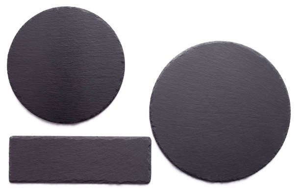 istock Slate stone pizza cutting board isolated at white background 1387275868