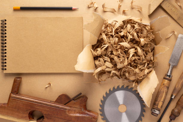 istock Plane jointer carpenter or joiner tool and wood shavings. Torn paper and woodworking tools 1387276875