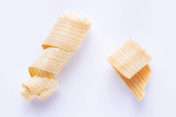 istock Wooden shavings isolated at white background. Wood shaving isolate 1387277029