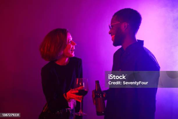 Couple at Party in Neon Light